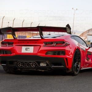Rear view of a Corvette C8 Z06 ERAY ZR1 with carbon fiber spoiler, parked on a race track